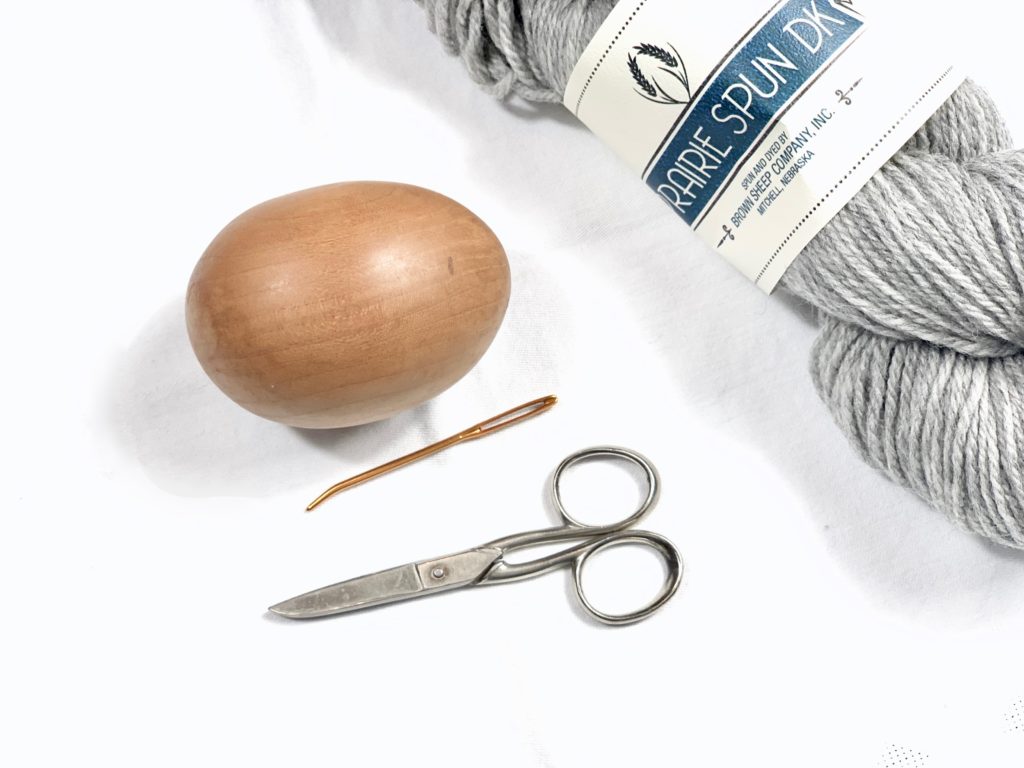 Darning egg with handle for darning socks and visible mending