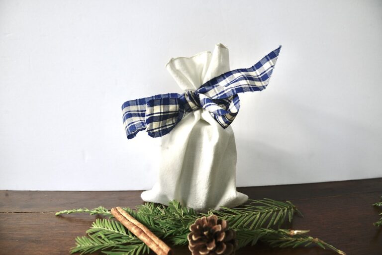 Christmas gifts in handmade bag with ribbon