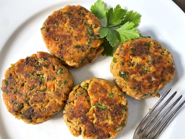 salmon cakes on plate with parsley garnish