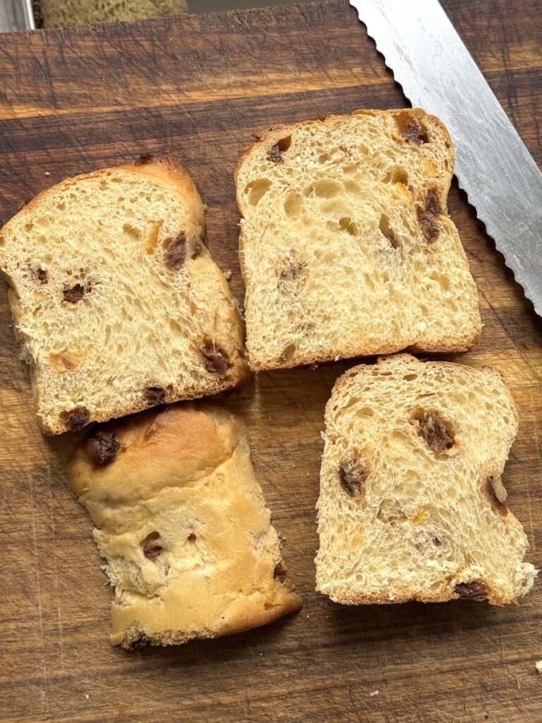 4 slices of panettone on cutting board