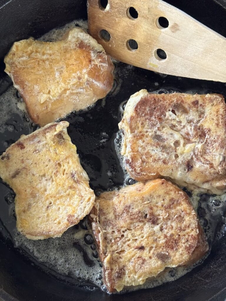 panettone slices in cast iron skillet