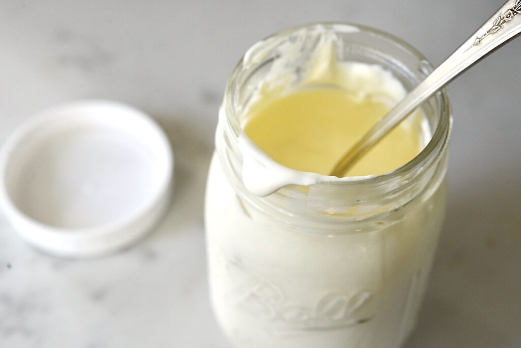 sour cream in mason jar with spoon