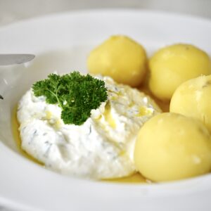 German quark cheese with potatoes on plate