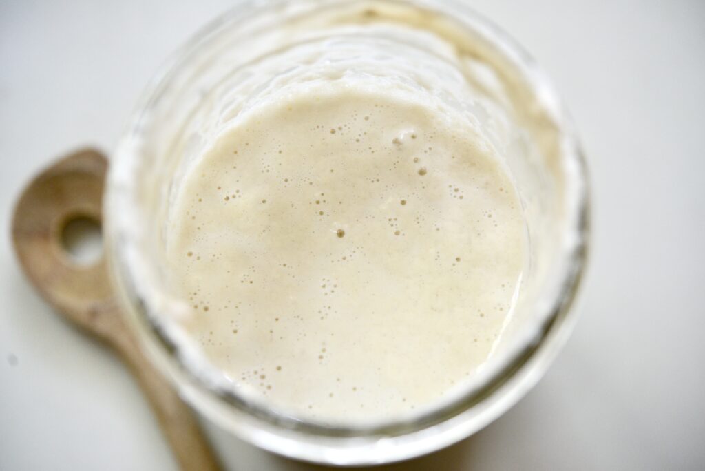 glass jar with active sourdough starter