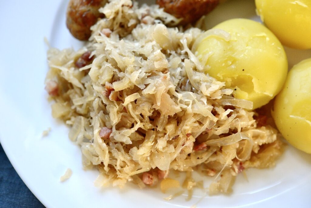 braised sauerkraut with sausage and potatoes on a plate