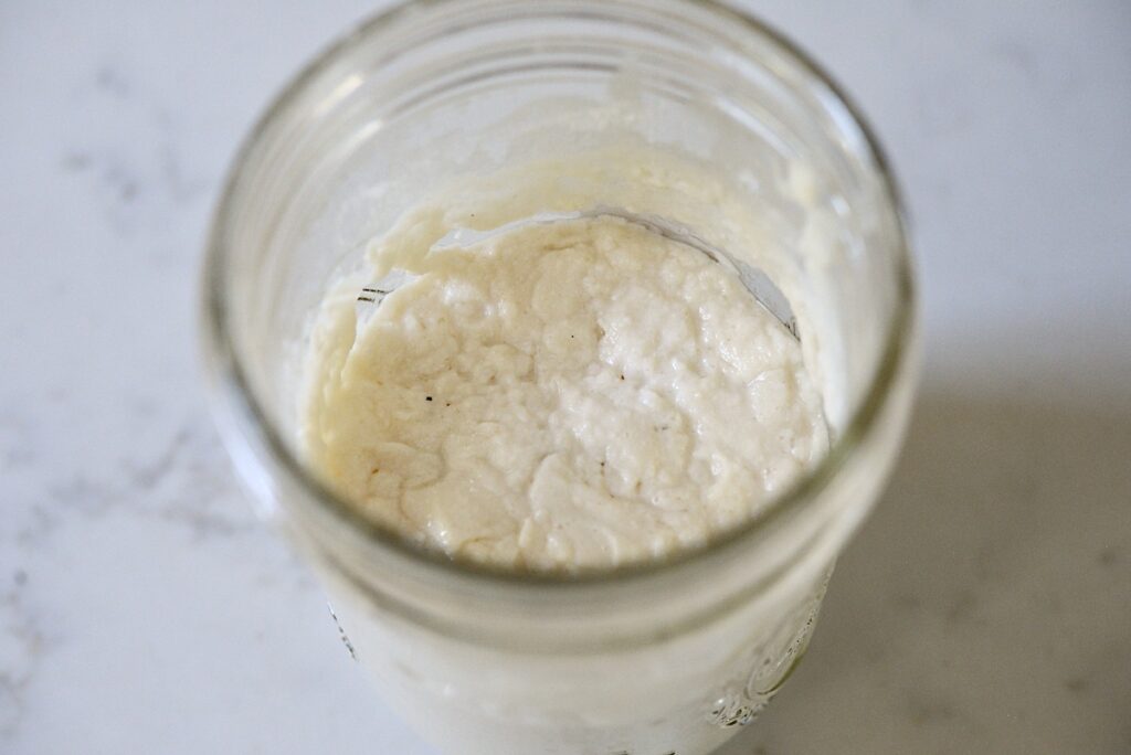 making a gluten free sourdough starter in a glass jar