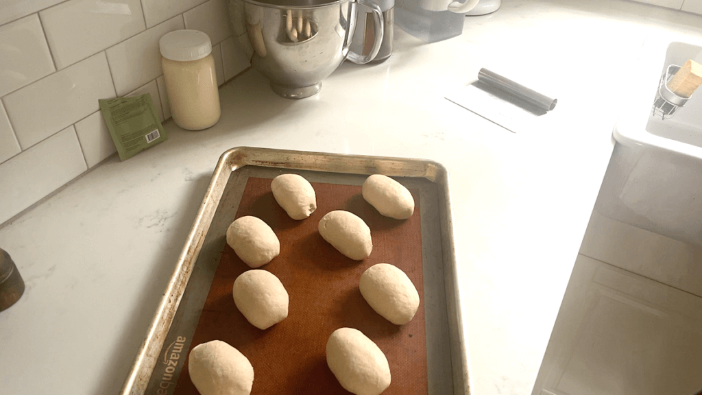 bread rolls on cookie sheet