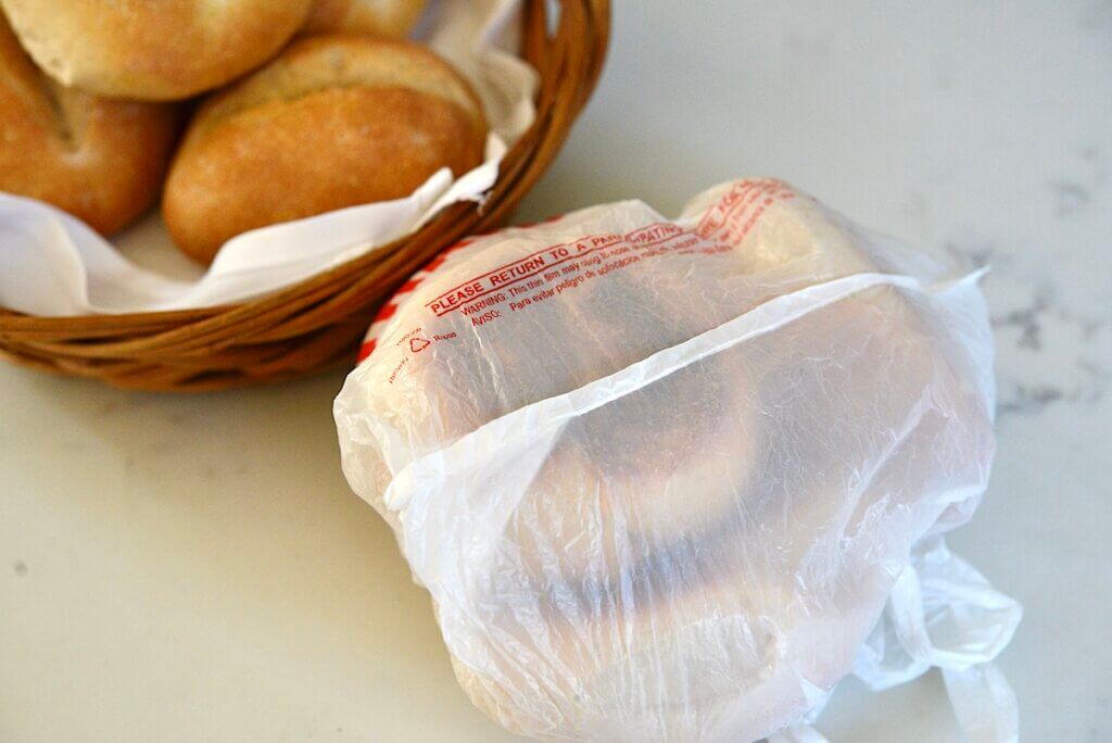 German bread rolls in baket and in plastic 