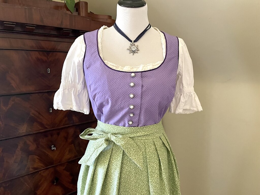 a dirndl in front of a chest of drawers