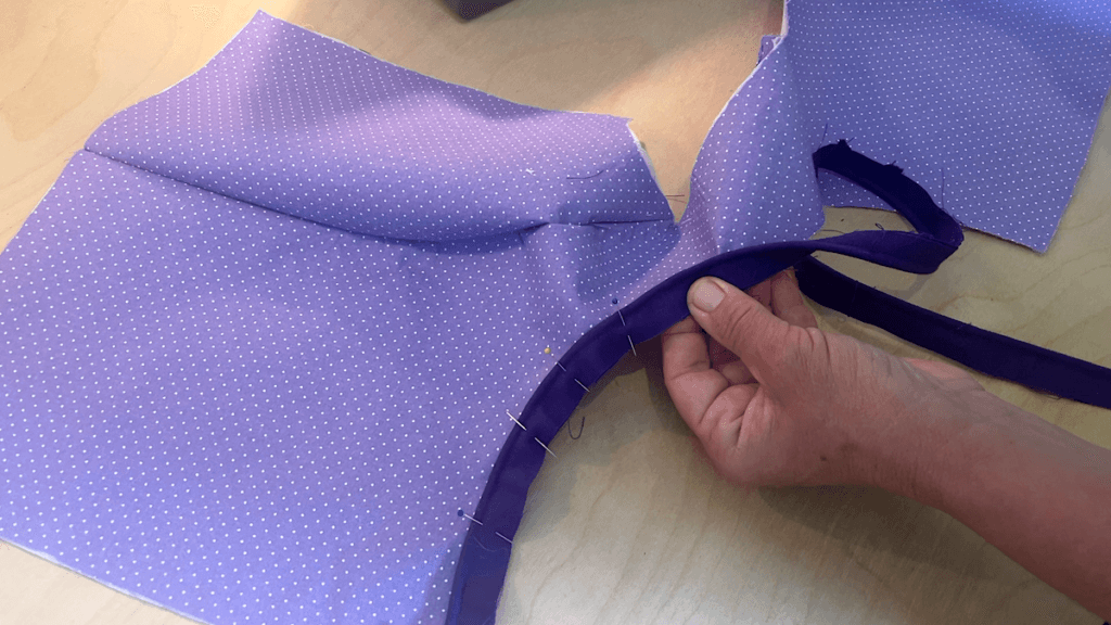 attaching the piping to the armhole