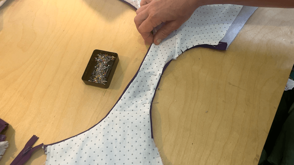 attaching the lining along the armholes