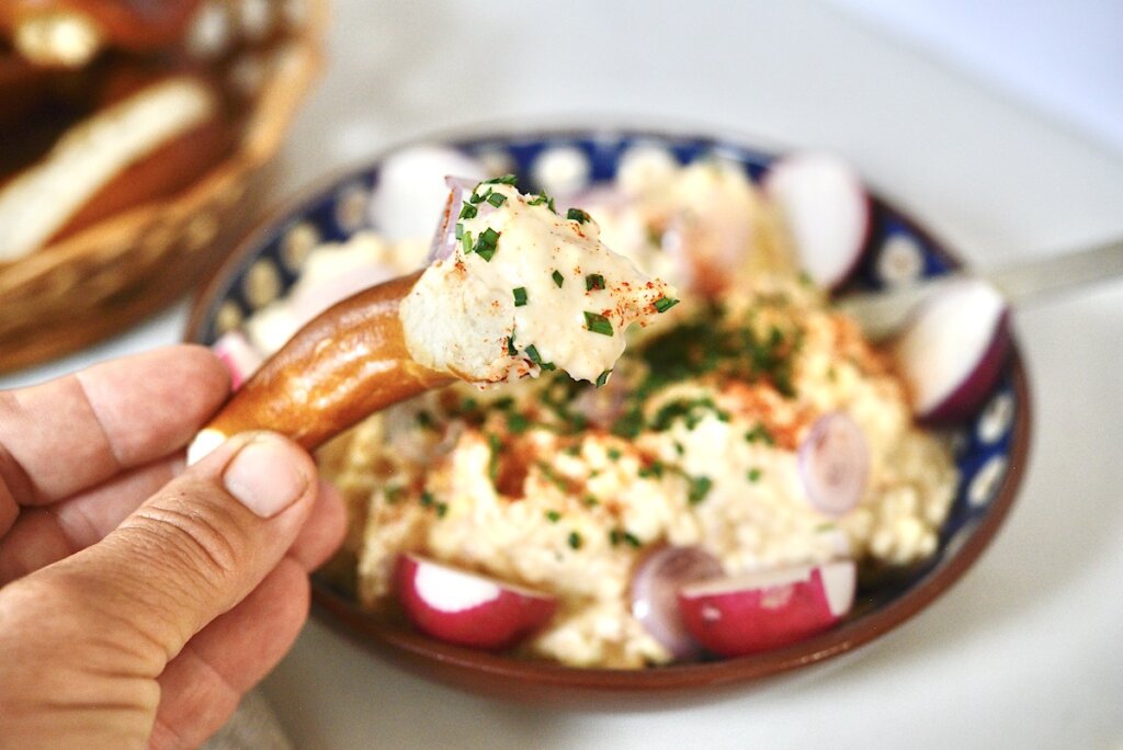 German beer cheese spread on a piece of soft pretzel