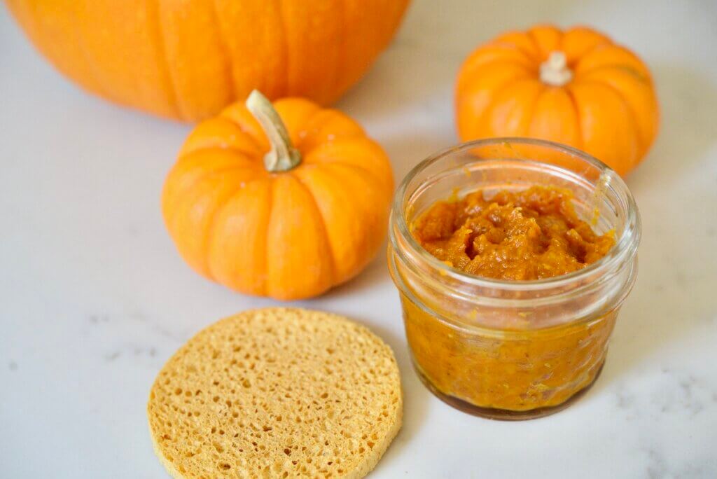 homemade pumpkin face mask in jar with pumpkins