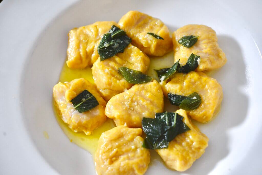 pumpkin gnocchi with sage brown butter sauce on plate