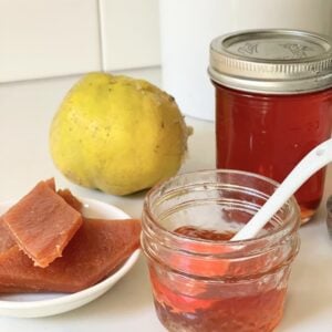 jars of quince jelly, quince paste, and quince on kitchen counter