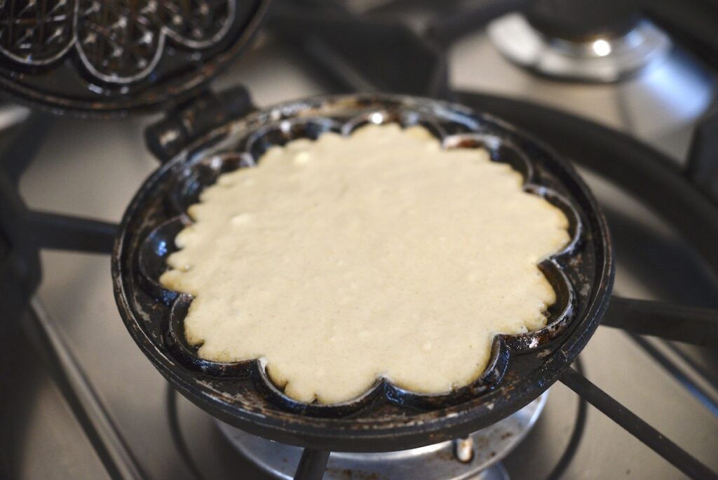 sourdough waffle batter in cast iron waffle maker