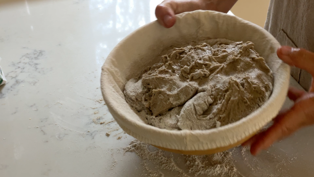 sourdough rye dough in proofing basket