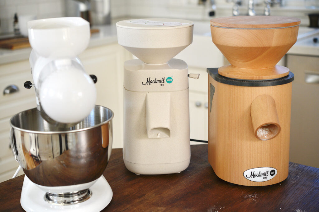 3 different Mockmill grain mills on kitchen table