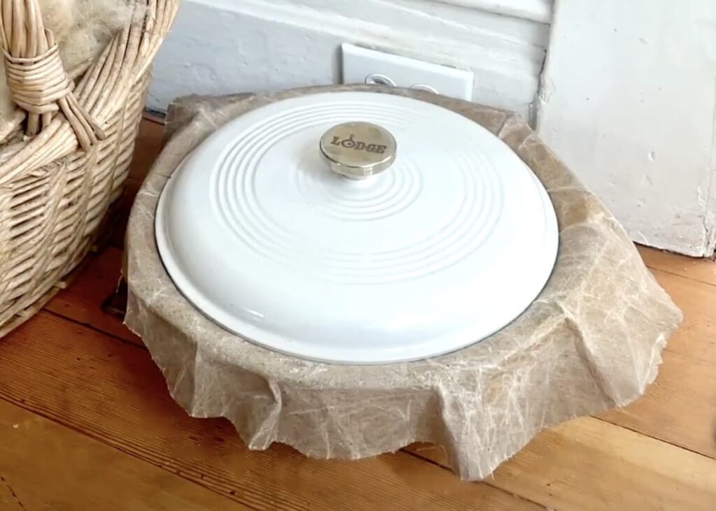 bowl covered with lid on floor