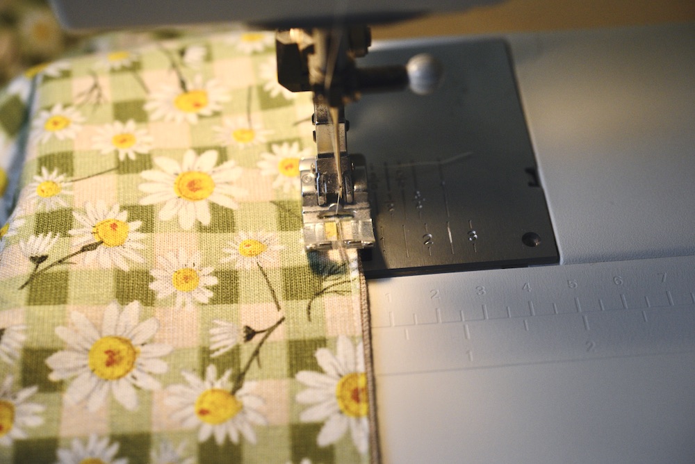 fabric sewn in sewing machine with top stitch