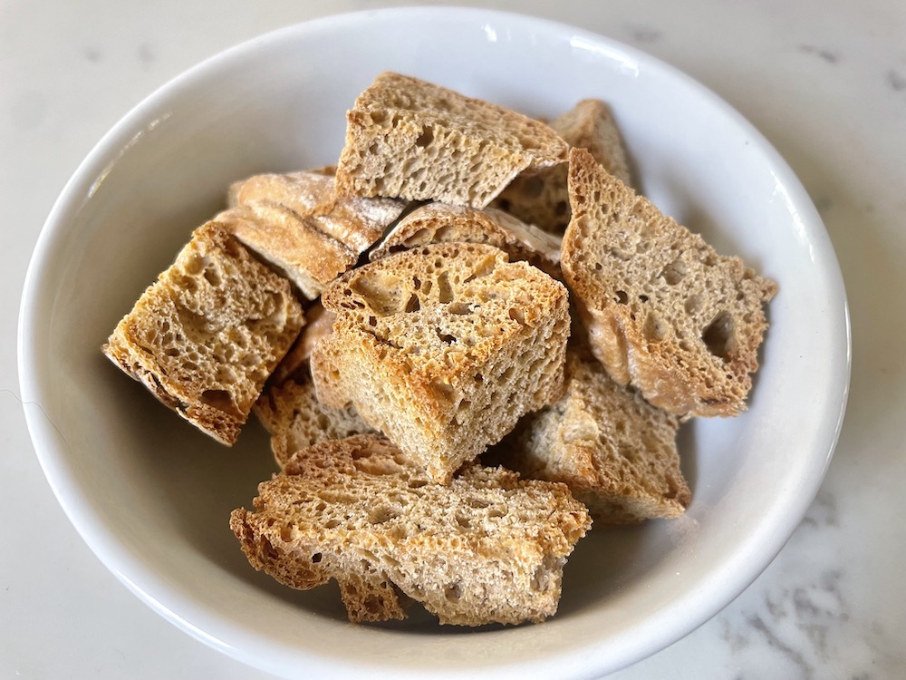 cubes of toasted sourdough bread in bowl