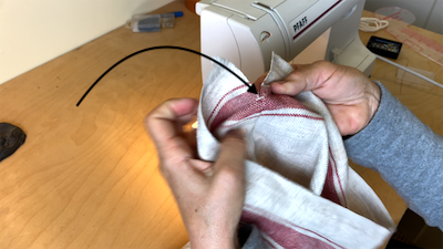 securing the seam with a back-and-forth stitch