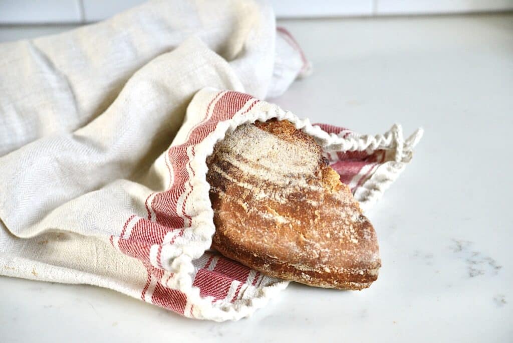 piece of bread in a linen bread bag