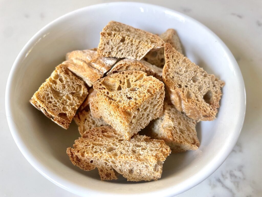 bread croutons in white bowl