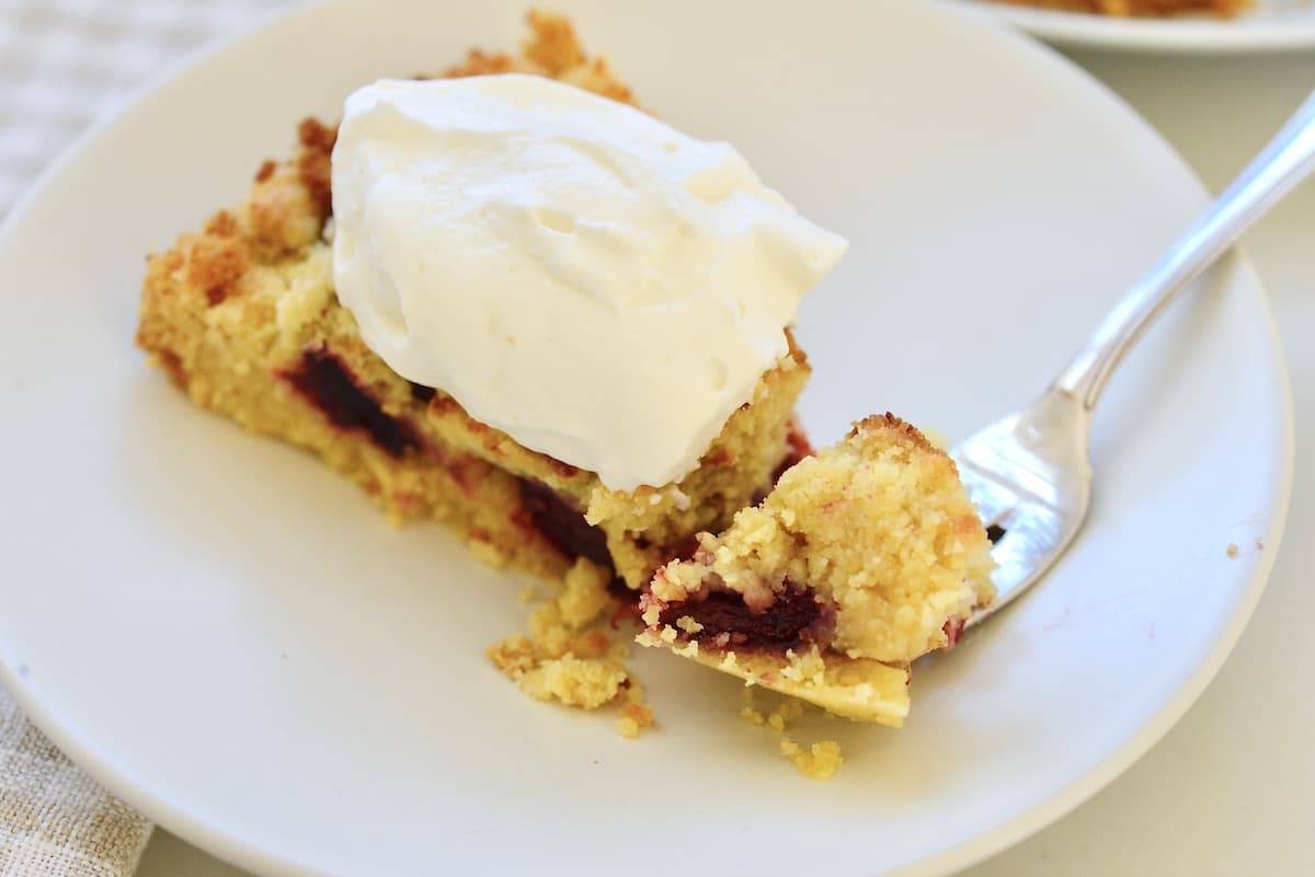piece of Streuselkuchen with a dollop of whipped cream