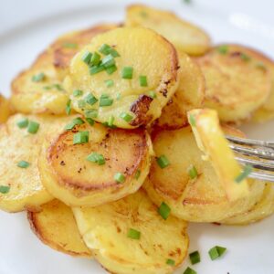 German fried potatoes on plate with fork