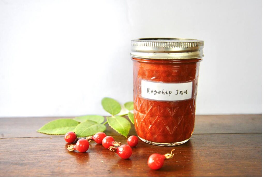 jar of rosehip jam with rosehips