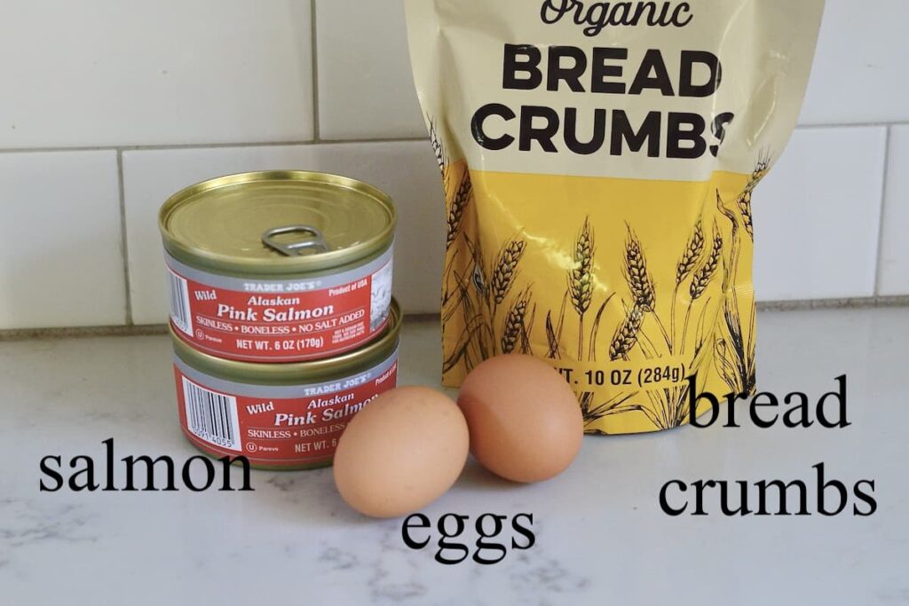 canned salmon, breadcrumbs, and eggs on kitchen counter