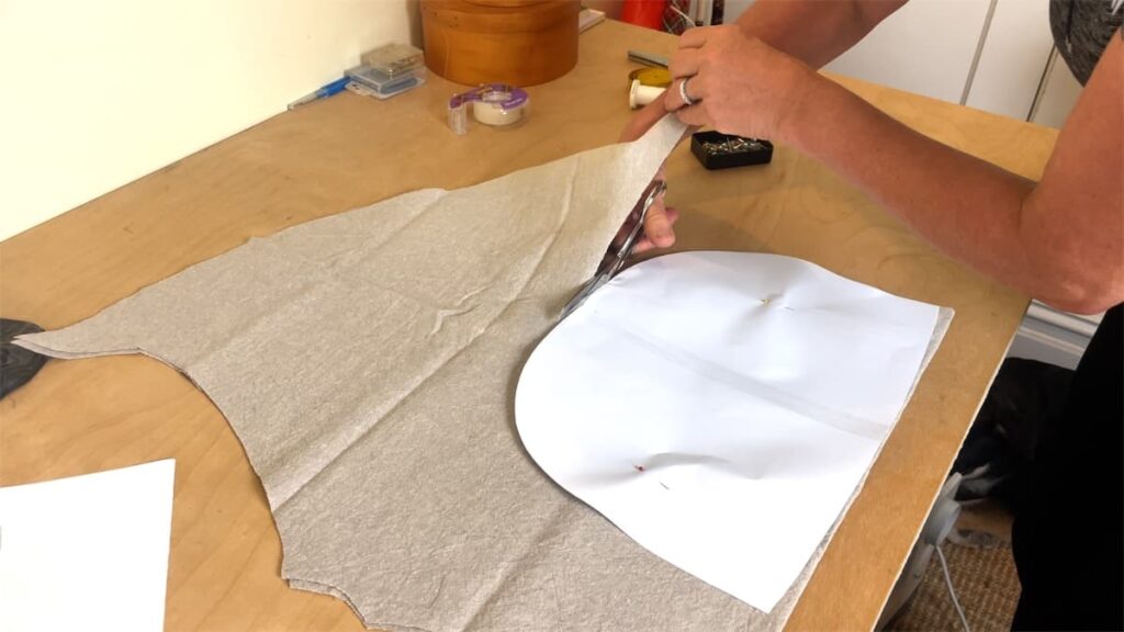 cutting out fabric with tea cozy pattern