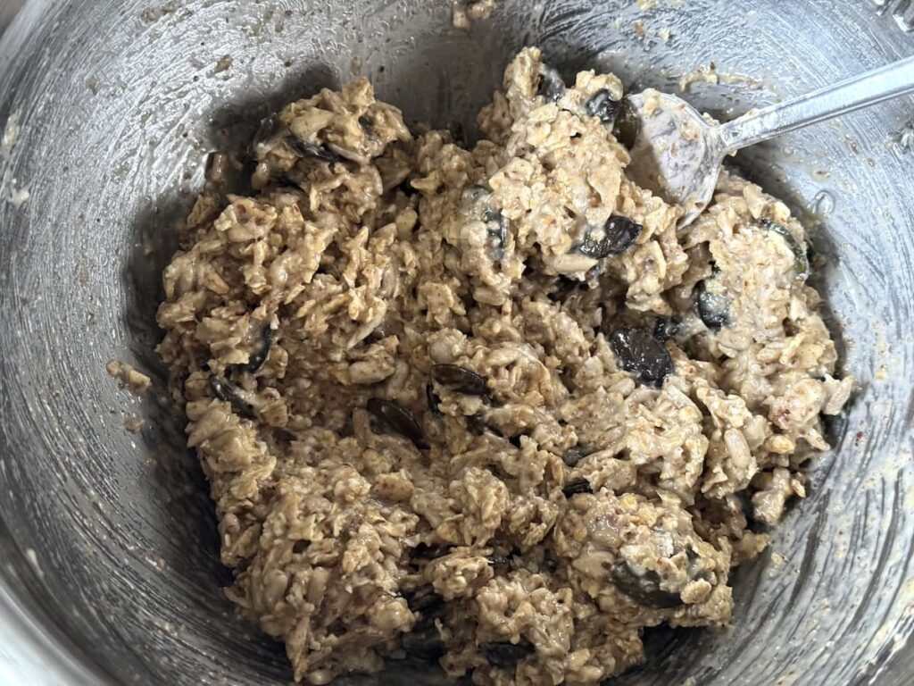 sourdough granola ingredients mixed together in big bowl