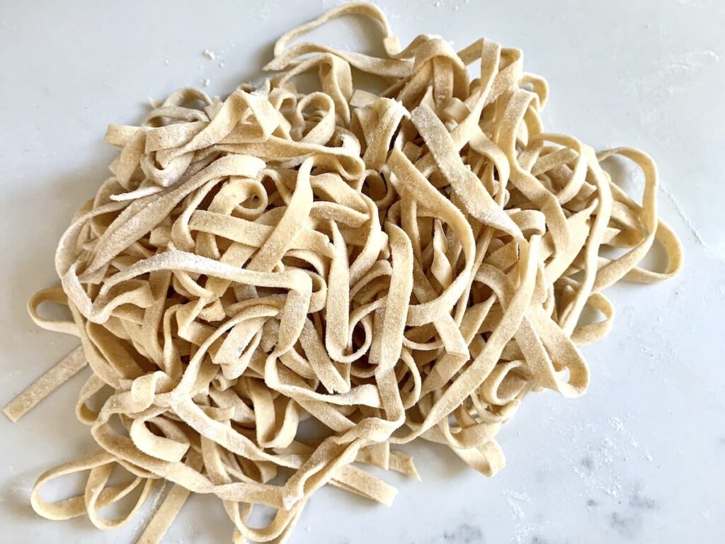 homemade uncooked sourdough pasta on kitchen counter