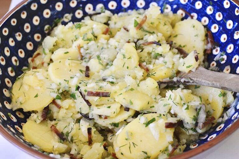 hot German potato salad in blue bowl