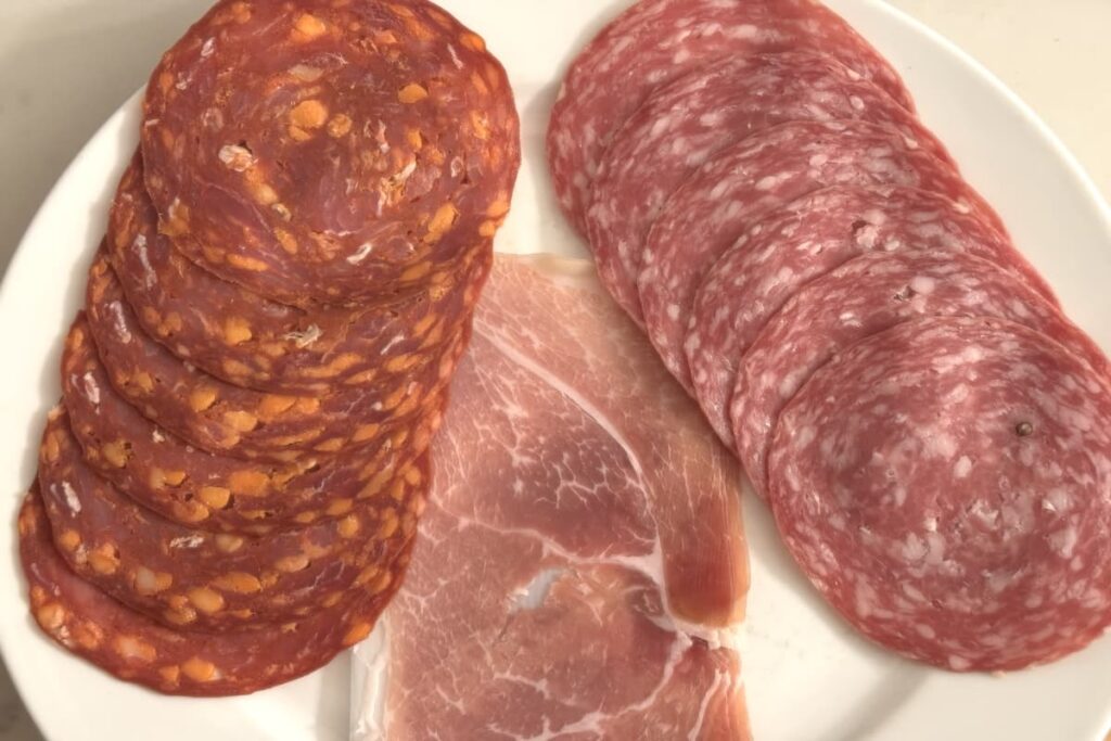plate with salami and prosciutto
