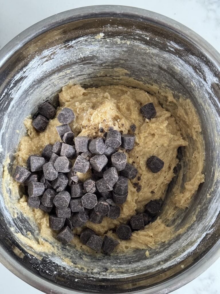 cookie batter in bowl with chocolate chips