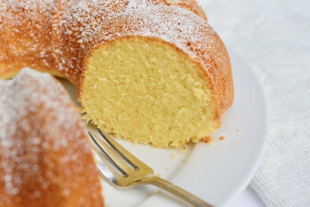round egg liqueur cake cut open on plate