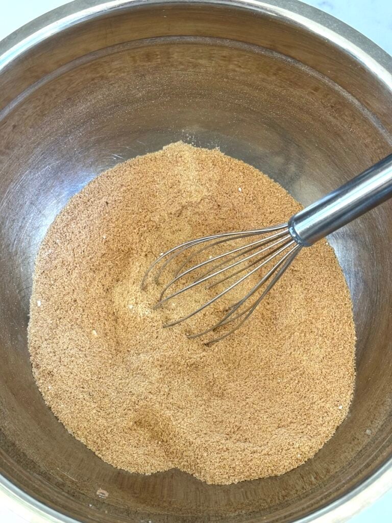 mixing bowl with dry ingredients and wire whisk