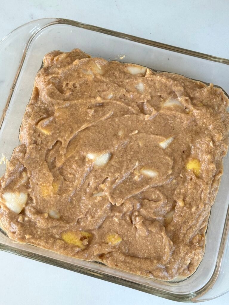 apple cake batter in greased baking dish