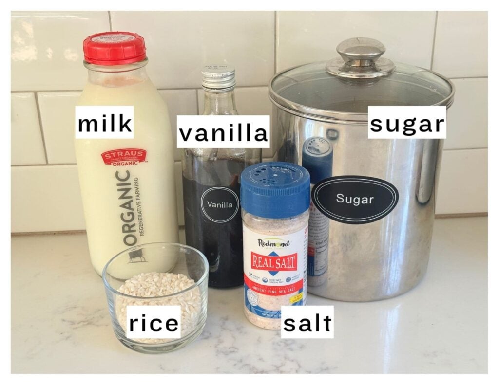 ingredients for German rice pudding: milk, vanilla, sugar, salt, and rice