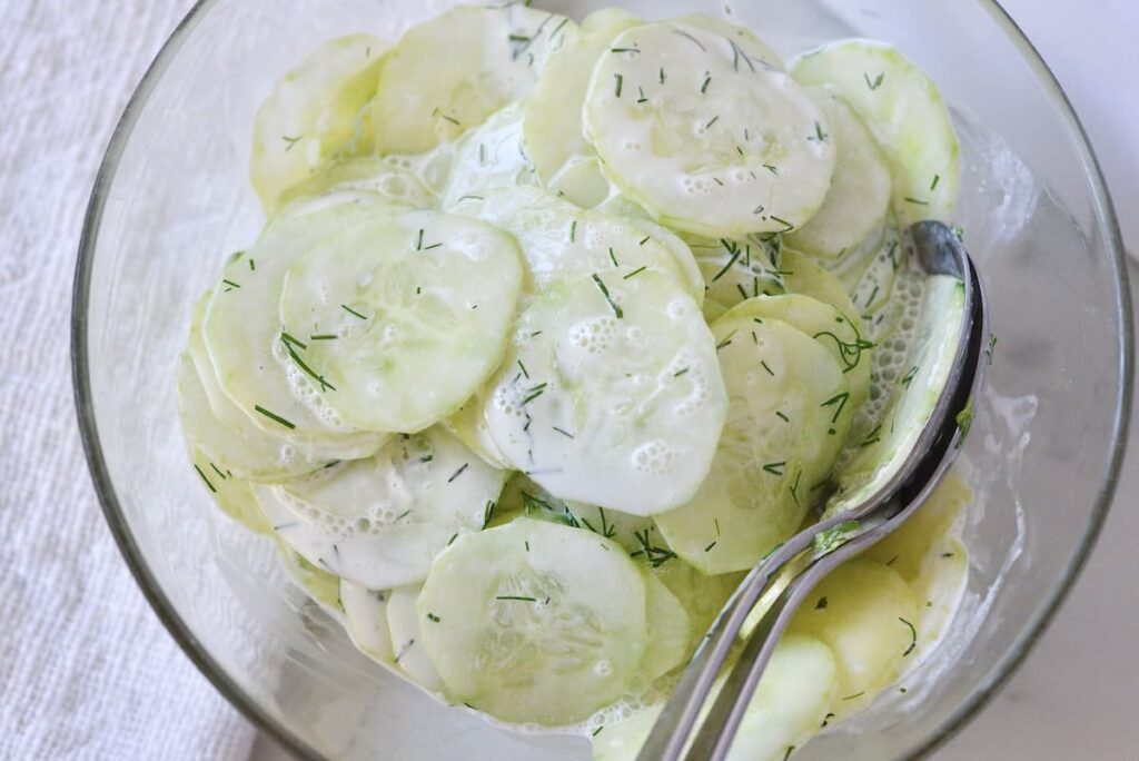 Gurkensalat in glass bowl