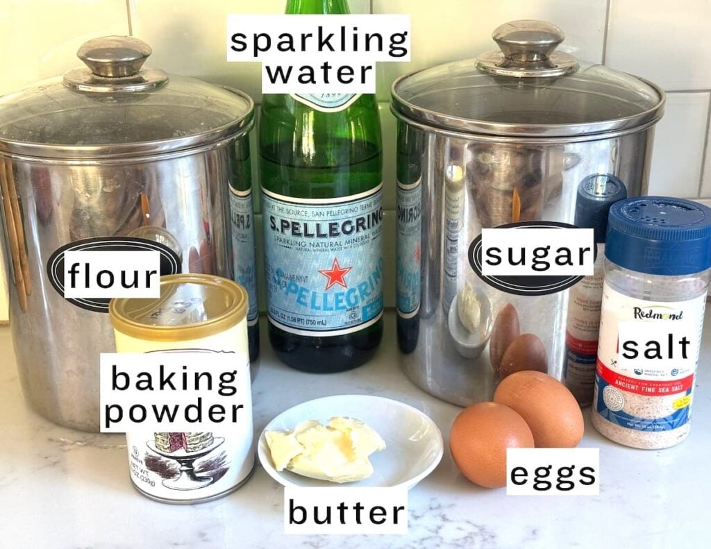 German apple fritter ingredients: flour, sparkling water, sugar, baking powder, butter, eggs, and salt