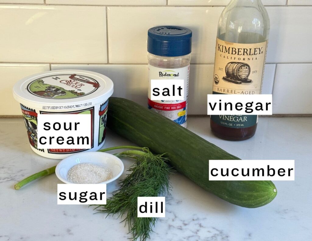 cucumber salad ingredients: sour cream, salt, vinegar, sugar, dill, cucumber