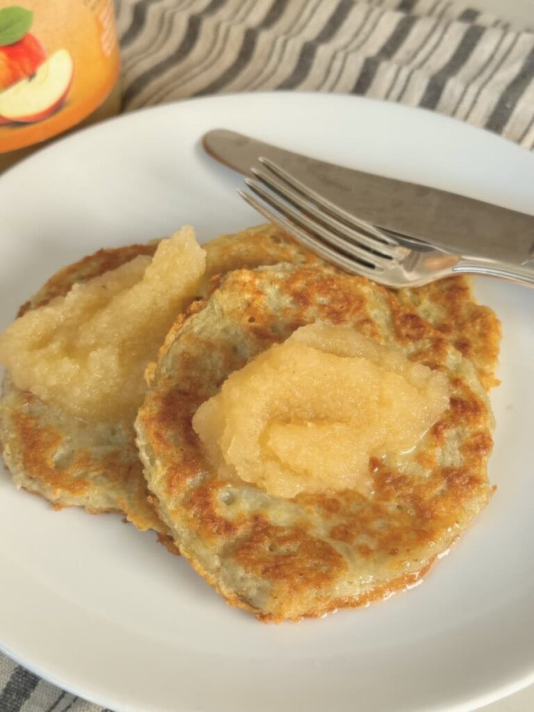 German potato cakes on plate with apple sauce