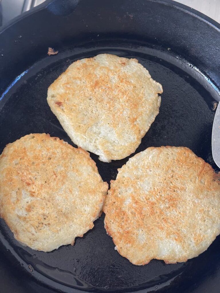 golden-brown potato cakes in skillet