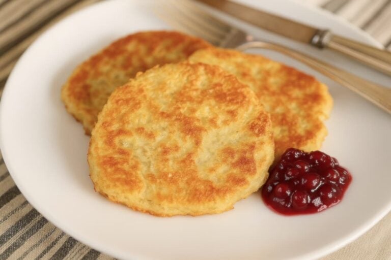 German potato cakes on plate with dollop of lingonberry jam