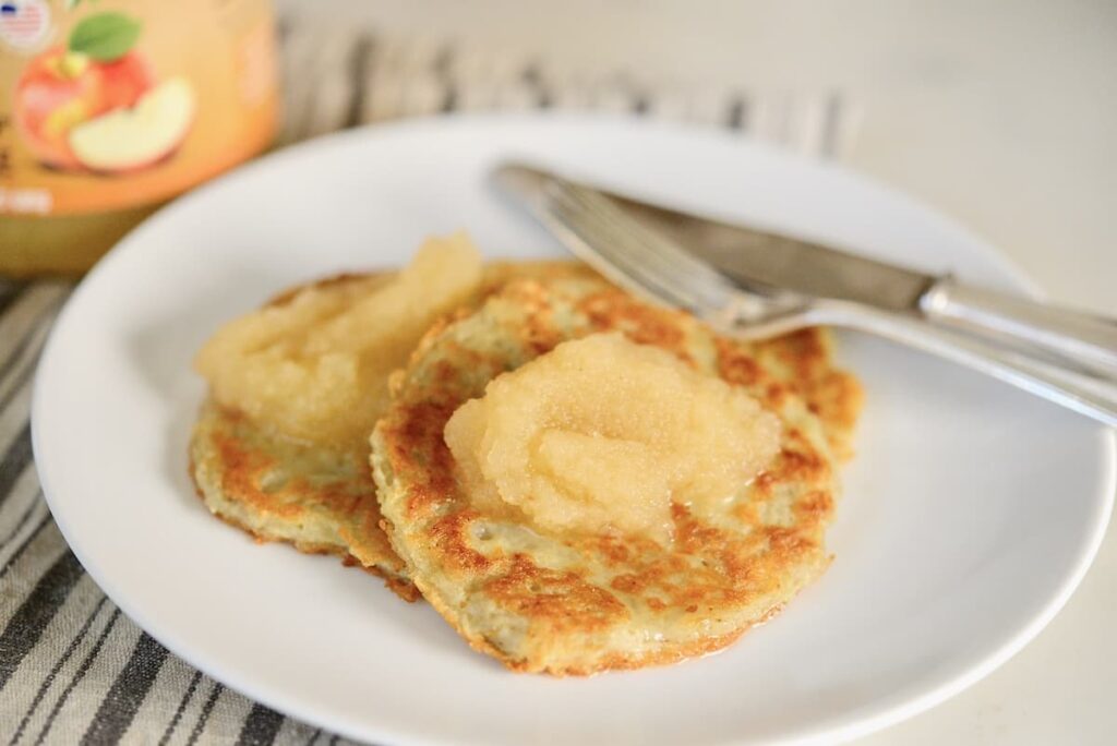German potato cakes on plate with apple sauce
