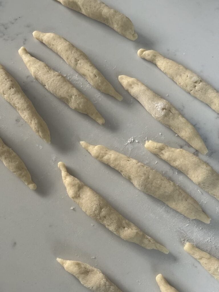 formed, raw Schupfnudeln on counter